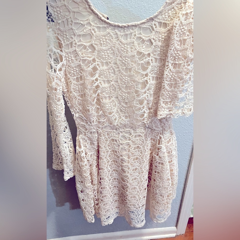 Du Jour medium dress with sleeveless slip under showing the quarter length arms